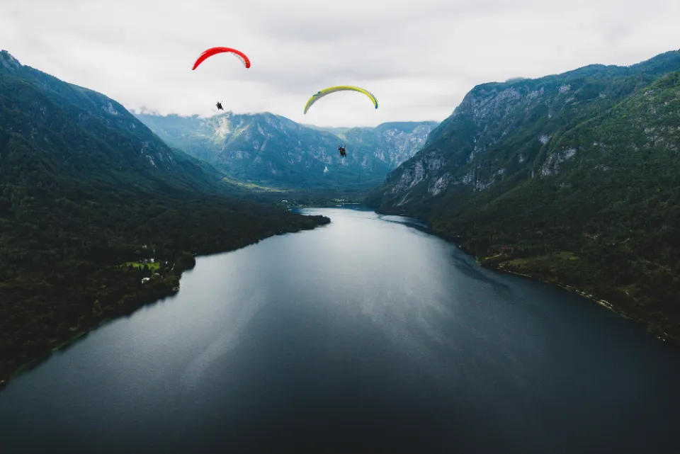 Paragliders above Lake Bohinj